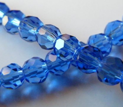 4mm round faceted dark blue crystal beads
